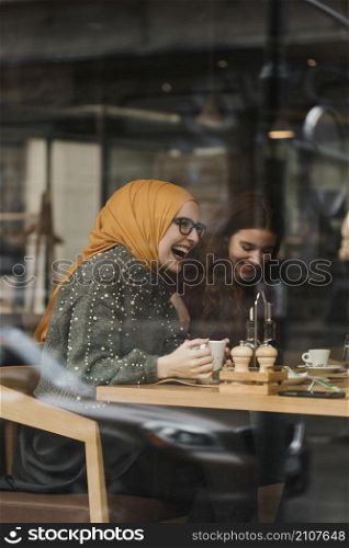 happy young girl laughing with friends