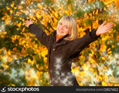 Happy young girl over abstract autumn background