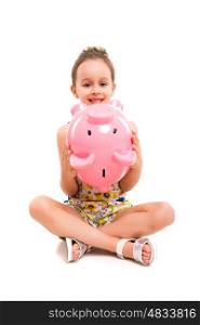 Happy young girl with a new piggy bank to start her savings