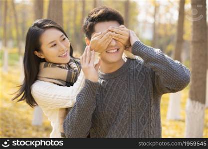 Happy young lovers in autumn