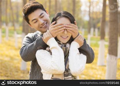 Happy young lovers in autumn
