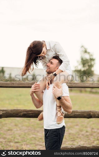 happy young man and woman having fun outdoors on a warm summer day. love story.. happy young man and woman having fun outdoors on a warm summer day. love story