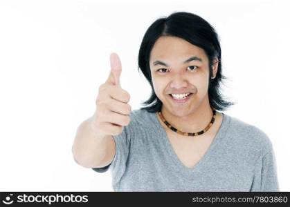 Happy young man giving thumb up gesture