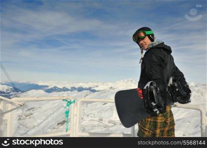 happy young man have fan while relaxing at snow with ski and snowboard sport at winter season