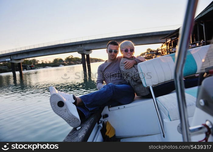 happy young man have fun at boat at sunset on summer season