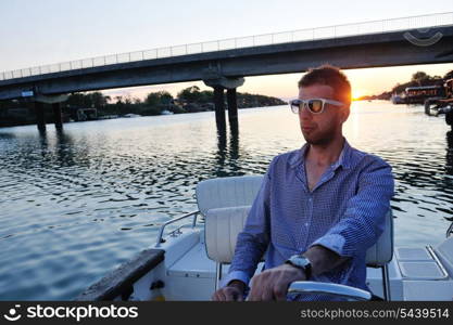 happy young man have fun at boat at sunset on summer season