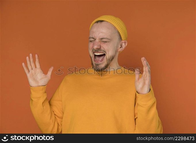 happy young man laughing indoors 6