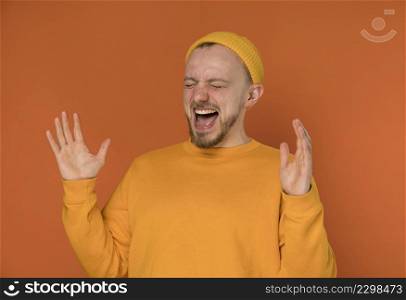 happy young man laughing indoors 6