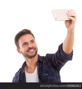 Happy young man taking self portrait photography through smart phone over white background.