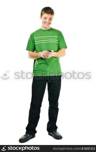 Happy young man texting on cellphone standing full body isolated on white background