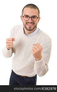 happy young man winning with open arms, isolated on white background
