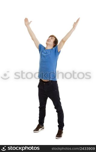 Happy young man with arms raised in the air, isolated on white background