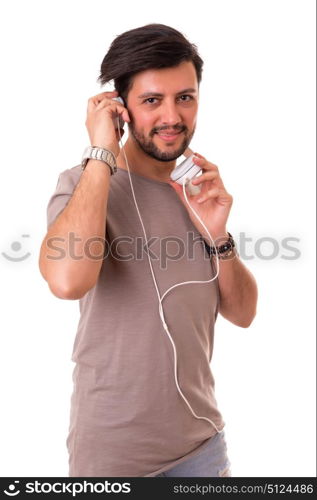 Happy young man with headphones on and listening to music