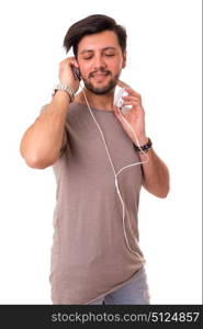 Happy young man with headphones on and listening to music