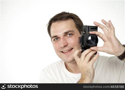 Happy young men using a camera to take photo, isolated on white