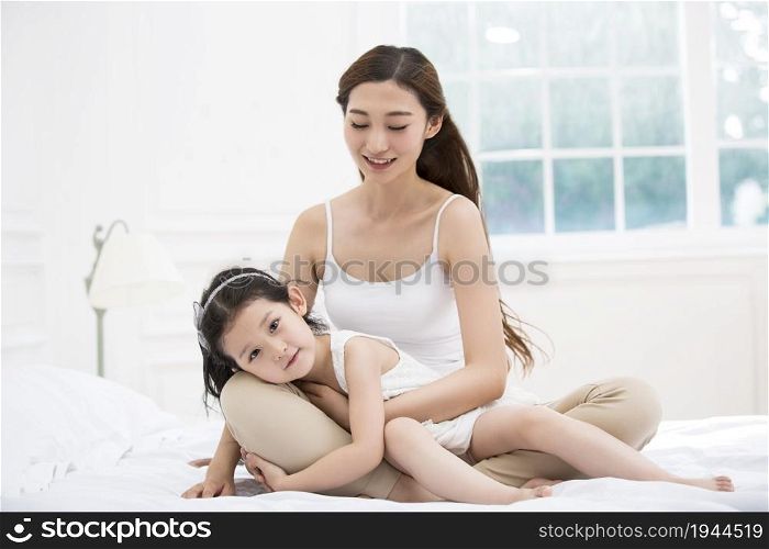 Happy young mother and daughter