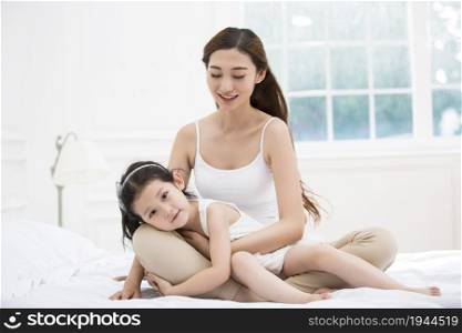 Happy young mother and daughter