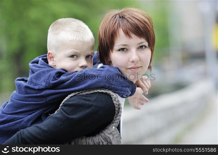 happy young mother and son have fun outdoor