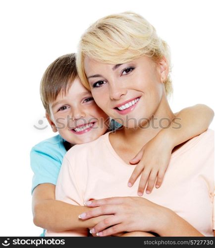 Happy young mother with son of six years. On white background