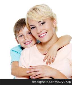Happy young mother with son of six years. On white background