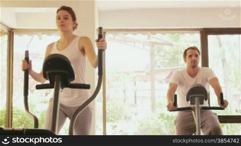 Happy young people, fun, leisure, lifestyle, fitness club, sports and workout, man and woman training in gym for wellness and well-being. 21of27
