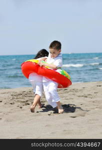 happy young people group have fun run and jump on beach beautiful sand beach