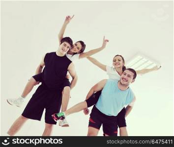happy young people group in excercise and relax in fitness club. young people group in fitness club