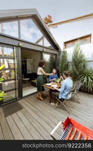 Happy young people have lunch in the courtyard and have a fun