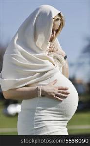 happy young pregnant womant have fun outdoor in nature at sunny day