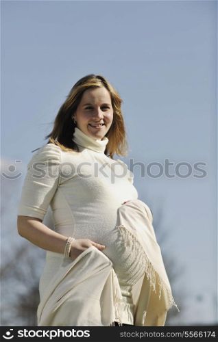 happy young pregnant womant have fun outdoor in nature at sunny day