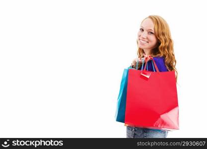 happy young redhead woman with shopping bags. happy laughing young redhead woman with shopping bags on white background
