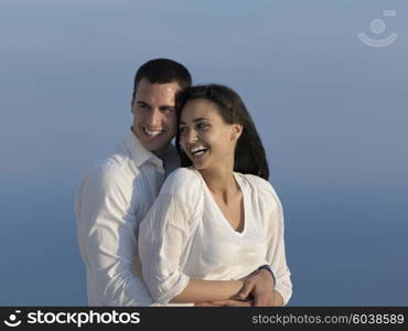 happy young romantic couple have fun relax smile at modern home outdoor terace balcony terace