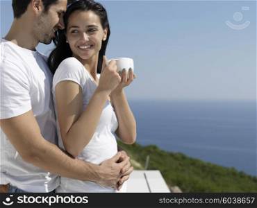 happy young romantic couple have fun relax smile at modern home outdoor terace balcony terace