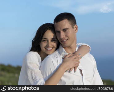 happy young romantic couple have fun relax smile at modern home outdoor terace balcony terace