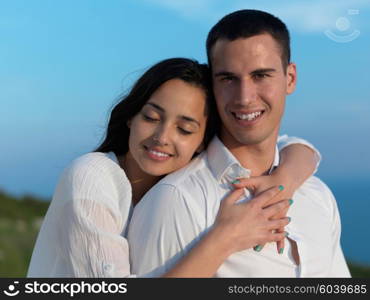 happy young romantic couple have fun relax smile at modern home outdoor terace balcony terace