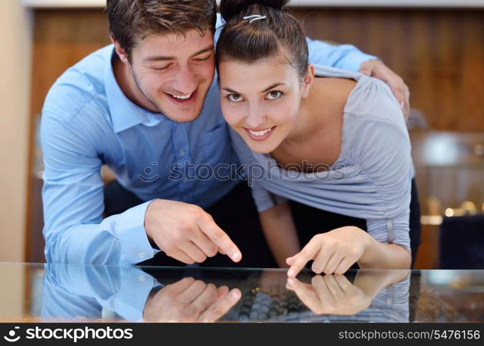 happy young romantic couple in love buy jewelry ring in luxury store