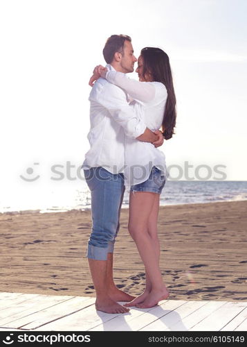 happy young romantic couple in love have fun on beautiful beach at beautiful summer day