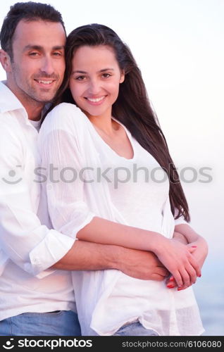 happy young romantic couple in love have fun on beautiful beach at beautiful summer day