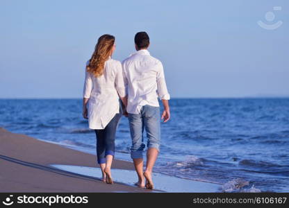 happy young romantic couple in love have fun on beautiful beach at beautiful summer day