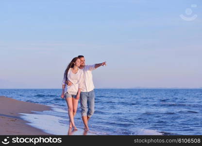 happy young romantic couple in love have fun on beautiful beach at beautiful summer day