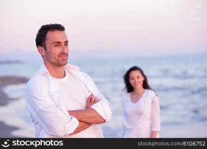 happy young romantic couple in love have fun on beautiful beach at beautiful summer day