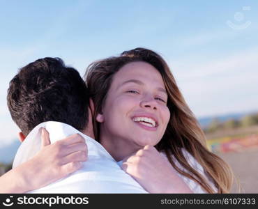 happy young romantic couple in love have fun on beautiful beach at beautiful summer day