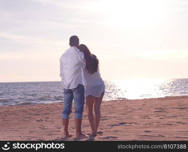 happy young romantic couple in love have fun on beautiful beach at beautiful summer day