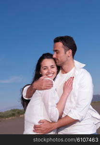 happy young romantic couple in love have fun on beautiful beach at beautiful summer day