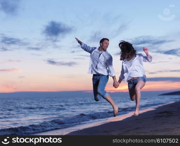 happy young romantic couple in love have fun on beautiful beach at beautiful summer day