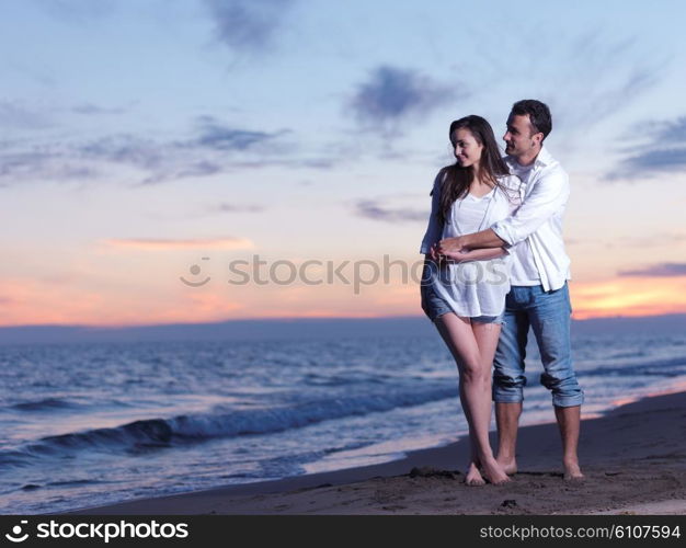 happy young romantic couple in love have fun on beautiful beach at beautiful summer day