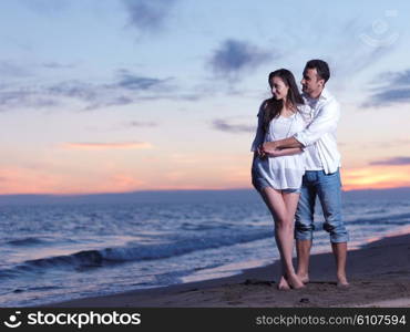 happy young romantic couple in love have fun on beautiful beach at beautiful summer day