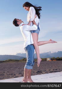 happy young romantic couple in love have fun on beautiful beach at beautiful summer day