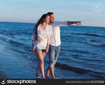 happy young romantic couple in love have fun on beautiful beach at beautiful summer day