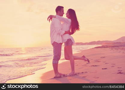 happy young romantic couple in love have fun on beautiful beach at beautiful summer day